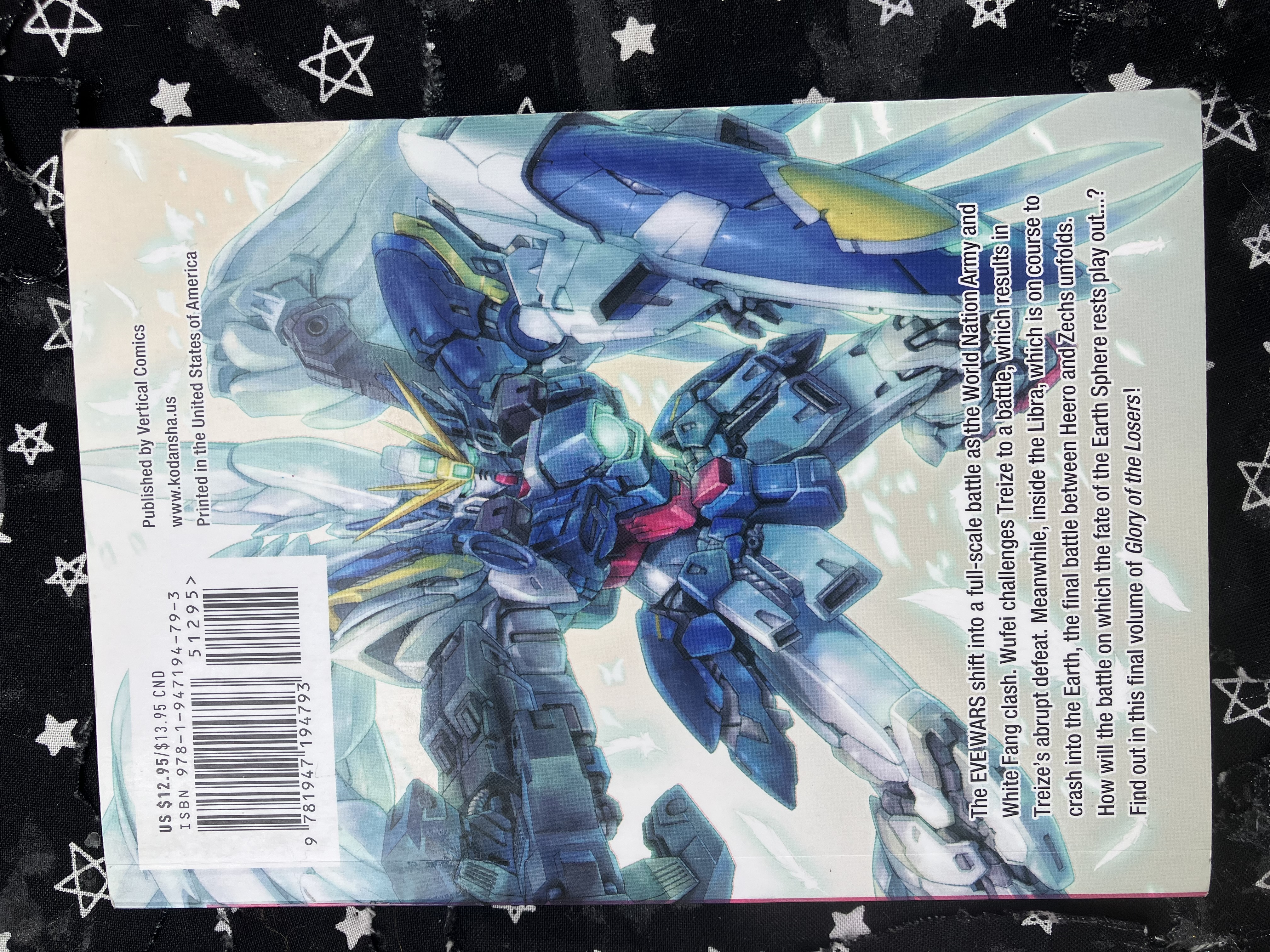 Back of volume 14 of the manga Mobile Suit Gundam Wing: Endless Waltz: Glory of the Losers with Wing zero posing.